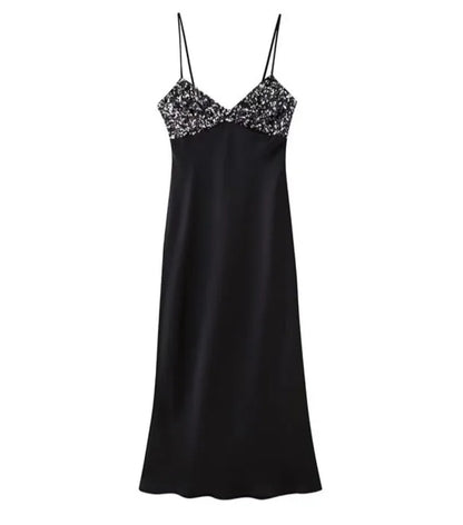 Black dress with sequins on the chest in satin