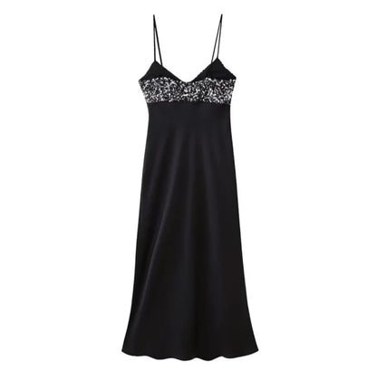 Black dress with sequins on the chest in satin